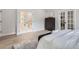 Beautiful main bedroom view with French doors, stylish decor, and bright lighting at 4 Meadowlark Ln, Littleton, CO 80123