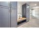 Well-organized mudroom with custom cabinets, a bench, and plenty of storage space at 4 Meadowlark Ln, Littleton, CO 80123