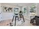 Bright home office featuring natural light from the windows, modern desk, and stylish decor at 4 Meadowlark Ln, Littleton, CO 80123