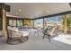 Relaxing covered patio with lounge seating, dining area, and outdoor entertaining space at 4 Meadowlark Ln, Littleton, CO 80123