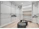 Custom walk-in closet with shelving, hanging rods, and wood floors at 4 Meadowlark Ln, Littleton, CO 80123