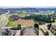 Aerial view of the rooftop of the condos with a view of the meadow and the surrounding neighborhood and mountains at 1574 Olympia Cir # 305, Castle Rock, CO 80104