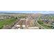 Scenic aerial view of neighborhood and golf course, townhomes, street and buildings at 1574 Olympia Cir # 305, Castle Rock, CO 80104