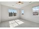 The bright bedroom is filled with natural light from large windows, creating a cheerful atmosphere at 1574 Olympia Cir # 305, Castle Rock, CO 80104