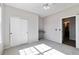 Bright bedroom features a ceiling fan, closet, neutral paint, and an ensuite bathroom at 1574 Olympia Cir # 305, Castle Rock, CO 80104