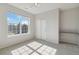 Bright bedroom features a ceiling fan, closet, neutral paint, and a large window with a view at 1574 Olympia Cir # 305, Castle Rock, CO 80104