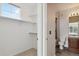 The organized closet provides easy access to the adjacent bathroom with updated fixtures at 1574 Olympia Cir # 305, Castle Rock, CO 80104