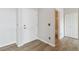 The entryway features light wood floors, white walls, and a conveniently located coat closet at 1574 Olympia Cir # 305, Castle Rock, CO 80104