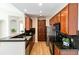 Modern kitchen features stainless steel appliances, dark countertops, and ample cabinet space for storage at 1574 Olympia Cir # 305, Castle Rock, CO 80104