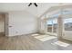 Bright living room boasts vaulted ceilings, natural light, and sliding door leading to the deck at 1574 Olympia Cir # 305, Castle Rock, CO 80104