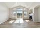 Bright living room with vaulted ceilings, fireplace, and sliding door to the deck offering natural light at 1574 Olympia Cir # 305, Castle Rock, CO 80104