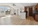 Open concept living room flows into the kitchen, with vaulted ceilings, fireplace, and natural light at 1574 Olympia Cir # 305, Castle Rock, CO 80104