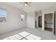 A spacious main bedroom has ample closet space, an ensuite bath, and large windows at 1574 Olympia Cir # 305, Castle Rock, CO 80104