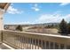 Balcony view featuring a neighborhood with trees, a street, and a distant hillside at 1574 Olympia Cir # 305, Castle Rock, CO 80104