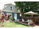 Charming backyard with a well-maintained lawn, patio, and a seating area at 3410 W 31St Ave, Denver, CO 80211