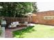 Backyard with a grill, patio, lush lawn, and a decorative brick wall at 3410 W 31St Ave, Denver, CO 80211