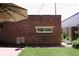 Brick wall backyard featuring mature trees and manicured lawn and patio at 3410 W 31St Ave, Denver, CO 80211