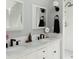 Bathroom featuring a double vanity with marble countertop and a tiled shower in the background at 3410 W 31St Ave, Denver, CO 80211