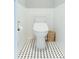 Cozy bathroom featuring a toilet with a white finish and contrasting tile floor at 3410 W 31St Ave, Denver, CO 80211