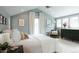 A beautiful bedroom featuring neutral walls, large windows, and a comfortable bed at 3410 W 31St Ave, Denver, CO 80211
