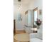 Stylish entryway featuring a mudroom area with built-in storage and a decorative mirror at 3410 W 31St Ave, Denver, CO 80211