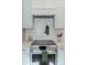 Modern kitchen with stainless steel appliances and white tiled backsplash at 3410 W 31St Ave, Denver, CO 80211
