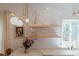 Stylish kitchen featuring open shelving, modern lighting, and tiled backsplash at 3410 W 31St Ave, Denver, CO 80211