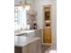 Well-designed kitchen featuring modern faucet, ample cabinetry, and open shelving at 3410 W 31St Ave, Denver, CO 80211