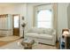 Bright living room with large window and mud room entrance with storage cabinets at 3410 W 31St Ave, Denver, CO 80211