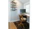 Functional home office area, with a unique wooden desk, a chair, and an area rug at 3410 W 31St Ave, Denver, CO 80211