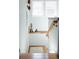 Bright staircase featuring hardwood steps, a wooden railing, and overhead lighting at 3410 W 31St Ave, Denver, CO 80211