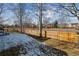 Fenced backyard with a lawn, trees, and a view of the surrounding neighborhood at 10535 Cottoneaster Way, Parker, CO 80134