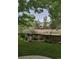 Landscaped backyard features a lush lawn, a wood fence, and a view of the neighborhood at 10535 Cottoneaster Way, Parker, CO 80134