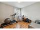 Bedroom converted to an exercise room features hard wood floors and natural lighting at 10535 Cottoneaster Way, Parker, CO 80134