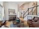 Inviting foyer with staircase, hardwood floors, and stylish decor, creating a warm welcome at 10535 Cottoneaster Way, Parker, CO 80134