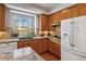 Well-lit kitchen featuring granite countertops and stainless steel appliances at 10535 Cottoneaster Way, Parker, CO 80134