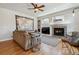 Spacious living room featuring a cozy fireplace, decor, and seating area at 10535 Cottoneaster Way, Parker, CO 80134