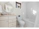 Bright bathroom with a white vanity, stylish mirror, and a well-maintained tub, providing a comfortable space at 579 Madison St, Denver, CO 80206