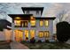 Stunning two-story stucco home with a tile roof, wrought iron balcony, and elegant architectural details at 579 Madison St, Denver, CO 80206