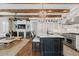 Spacious kitchen open to the living room, featuring a large island and modern appliances at 579 Madison St, Denver, CO 80206