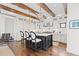 Bright kitchen with a large island, marble countertops, and wooden ceiling beams at 579 Madison St, Denver, CO 80206