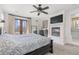 Spacious main bedroom boasts a fireplace, ceiling fan, balcony access, and ensuite bathroom at 579 Madison St, Denver, CO 80206
