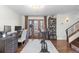 Bright home office with hardwood floors, custom desk, modern lighting, and exterior access at 579 Madison St, Denver, CO 80206