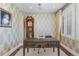 Traditional home office featuring a large desk, grandfather clock, and custom wallpaper at 579 Madison St, Denver, CO 80206