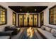 Cozy patio featuring a fire pit, lounge chairs and glass doors leading inside the house at 579 Madison St, Denver, CO 80206