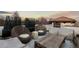 Comfortable rooftop deck featuring stylish lounge furniture and panoramic views at sunset at 579 Madison St, Denver, CO 80206