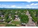 Scenic aerial shot of a home with a spacious yard and mountain views in the distance at 7120 S Sheridan Ct, Littleton, CO 80128