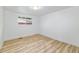 Empty bedroom with wood floors, a window, and lots of natural light at 7120 S Sheridan Ct, Littleton, CO 80128