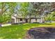 Well-kept single story home with charming landscaping and a neatly maintained lawn at 7120 S Sheridan Ct, Littleton, CO 80128