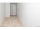 An empty hallway with neutral colored carpet and white walls at 7120 S Sheridan Ct, Littleton, CO 80128